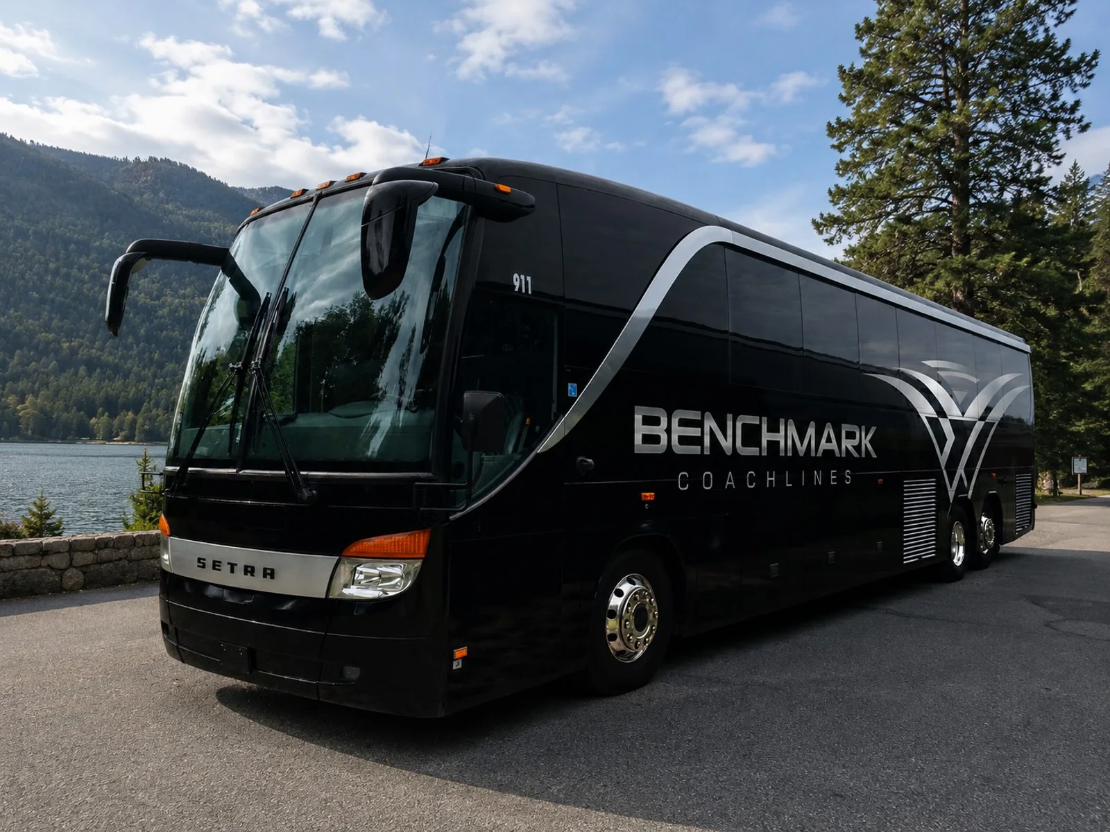 Luxury motorcoach parked at a highway rest stop during a long distance group trip - Benchmark Coachlines