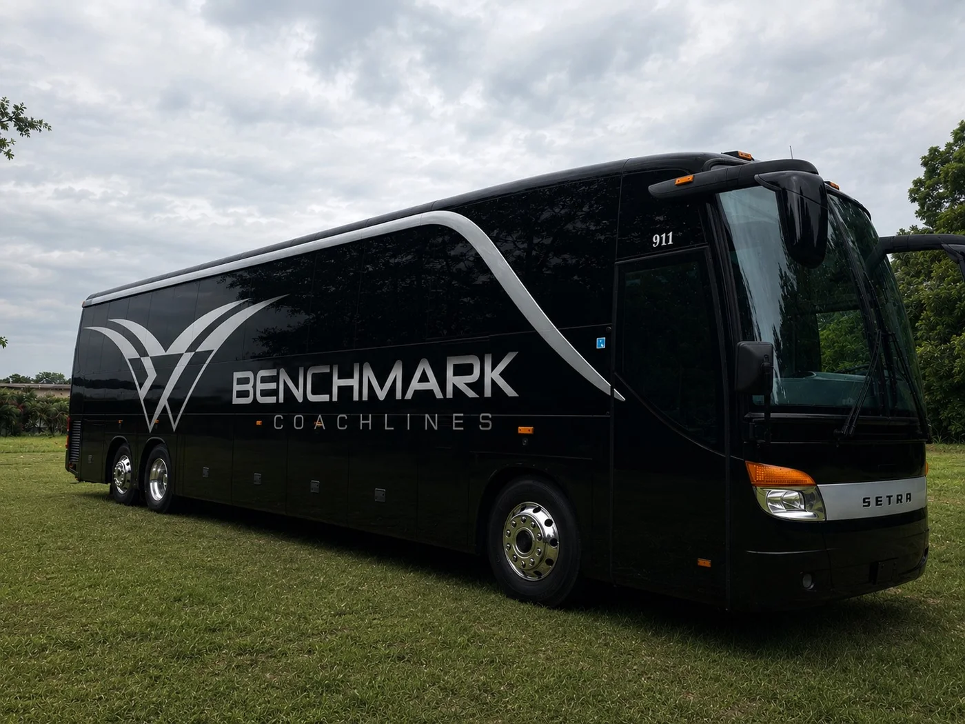 Benchmark Coachlines black Mercedes Setra motorcoach ready for group charter service in North Florida